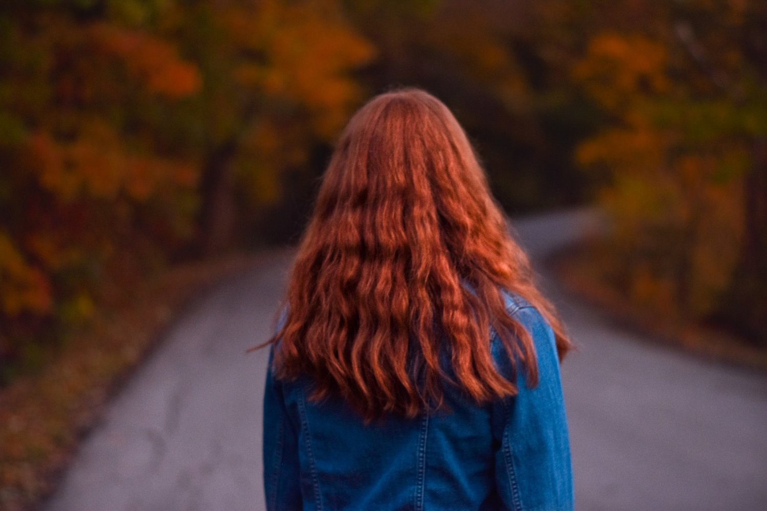 Back of a woman's head with long red hair