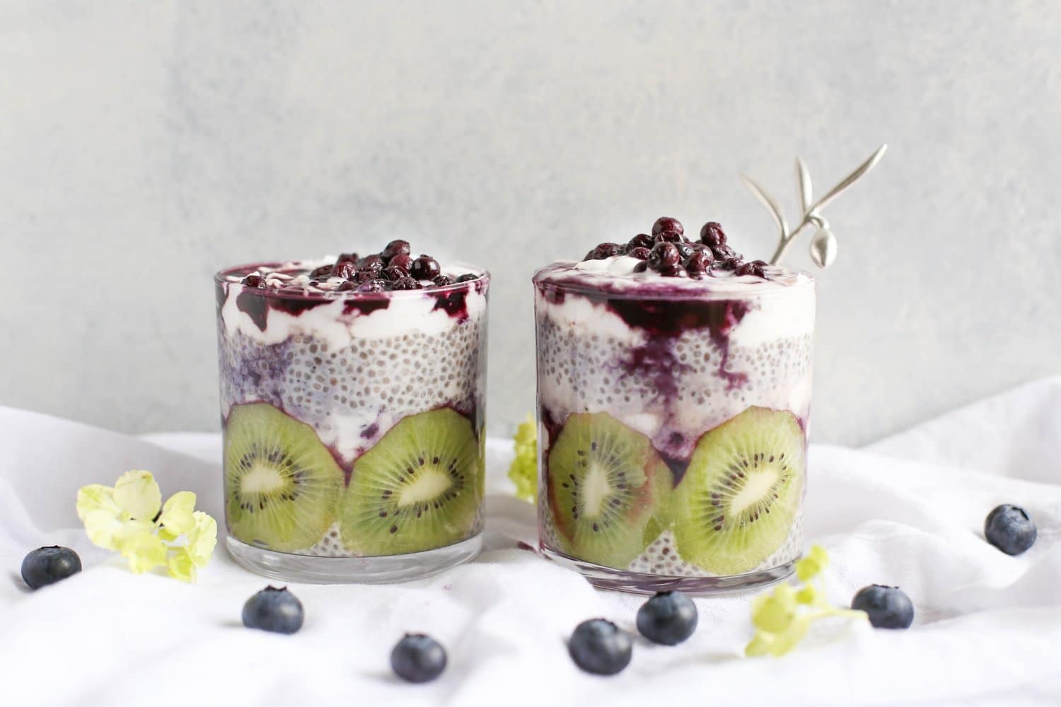 Glasses of chia seed pudding with kiwi