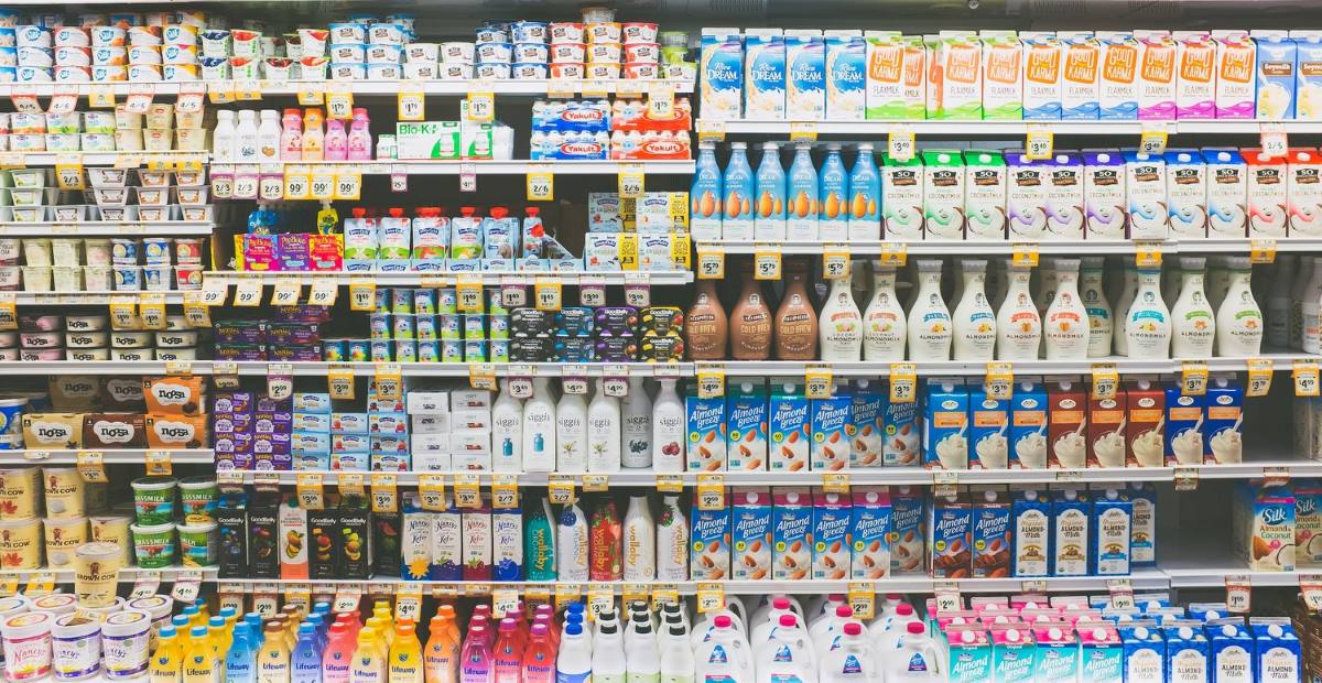 Grocery store shelves full of non-dairy milk products